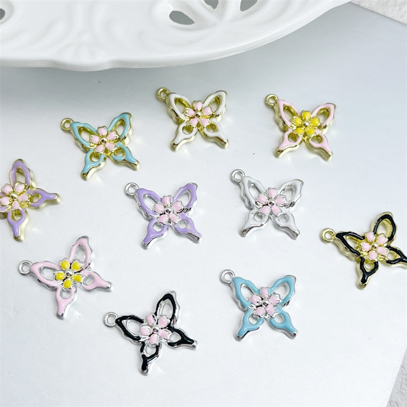 卸売 50 ピース/ロットドロップオイル動物漫画蝶の形合金フ - Men Accessories Locket のレビューと価格